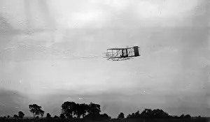 Dayton: Side view of flight 45, Orville flying to the left at a cons