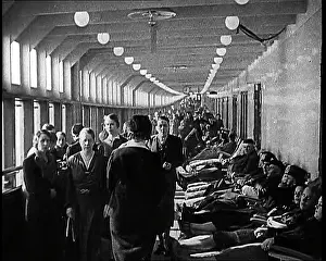 Loungers: A View Down a Long Corridor Aboard the Strength