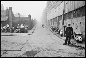 Mopeds: A view looking south along the east elevation