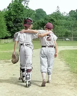 Leaguers: Back View of Pair of Little Leaguers Walking Off