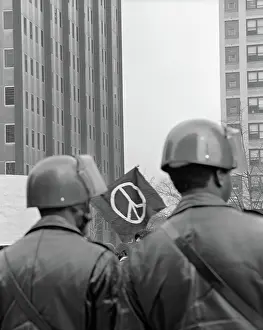 Anti War: Back view of two policeman in helmets at demonstration
