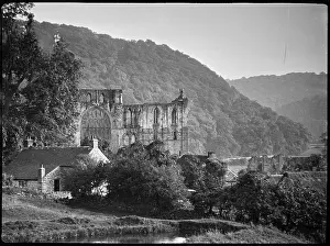 Rievaulx: View of Rievaulx Abbey with a cottage in the foreground