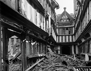 Almshouse: A view showing bomb damage to the 16th century