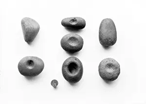 Lammers: A view of stone lammers against a white background