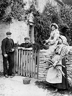 Socialising: Villagers chatting over cottage gate, 1890s