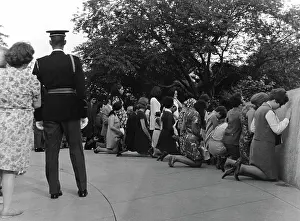 Parapet: Visitors praying at Robert Kennedy grave