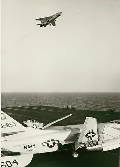 Approaches: A Vought F-8 Crusader approaches the USS Independence