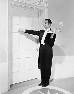 Fortunate: Waiter with tray knocking on a door