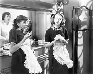 Employ: Two waitresses standing together