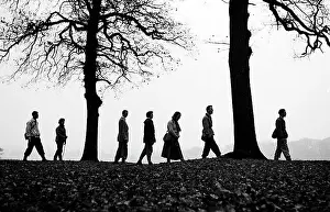 Greeley: Walkers on the brow of a hill making a silhouette