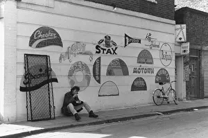 Checker: Wall with recording studio artwork and logos