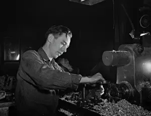 Bantam: War production worker operating a shaving machine, 1942
