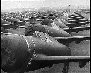 Warplanes: Warplanes Sitting In An Airfield With Covers