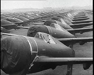 Warplanes: Warplanes Sitting In An Airfield With Covers