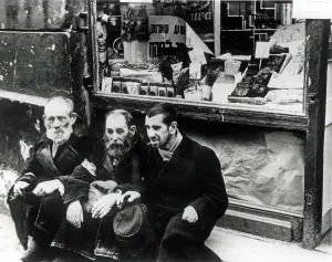 Muranow: Warsaw Ghetto - Three beggars on the sidewalk
