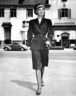 Drab: Wartime suit for women in defense work by ?