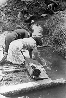 Frenchmen: Washing day in a refugee camp, 1940