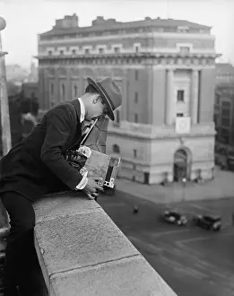 Newsmen: Washington, D.C. photographer taking a picture from