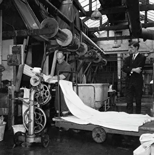 Cowling: Weavers operating a loom - checking fabric quality