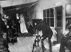 Emotions: Wedding couple at a photographer, around 1900