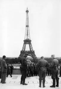 Output: Wehrmacht soldiers in front of the Eiffel Tower in Paris
