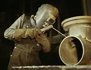 Tennessee: Welder making boilers for a ship, 1942
