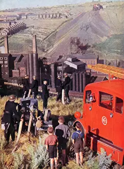The John Hinde Archive (stephen Bourne): Welsh Firemen in position above the pit-head and railway