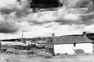 Heaps: Welsh landscape with old and new buildings
