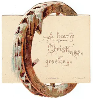 Encrusted: Mill wheel with ice and snow on a Christmas card