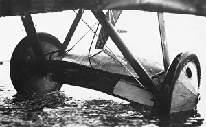 Submerged: Wheels of a plane in muddy field, WW1