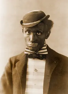Stereotyped: White man in blackface as minstrel. Minstrel ?