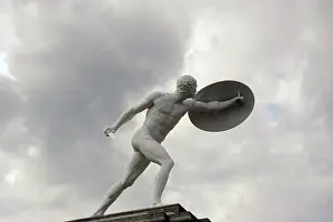 Protect: White statue of a warrior holding a sword and a shield. Char