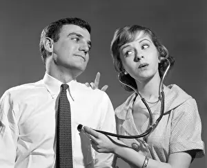Heartbeat: Wife with Stethoscope on Husband