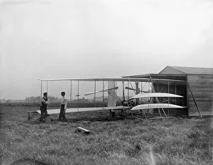 Huffman: Wilbur and Orville Wright with their second powered machine;