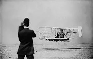 Wilber: Wilbur Wright 1867-1912 takes off for a ?