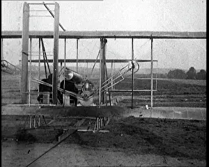 Kitty: Wilbur Wright Boarding A Wright Brothers Plane