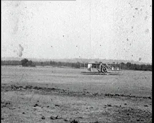 Kitty: Wilbur Wright Landing A Wright Brothers Plane
