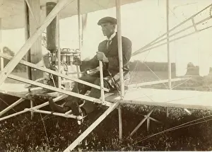 Wilbur: Wilbur Wright in his machine in 1905