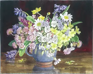 Primroses: Wild flowers in a blue jug