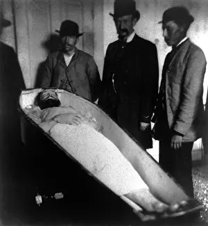 Mourner: Wild West. Jesse James, dead, in coffin, ?