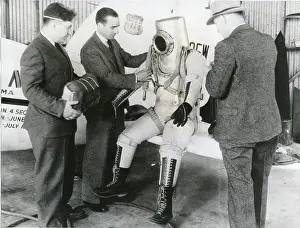 Wiley: Wiley Post makes a final examination of his pressure suit