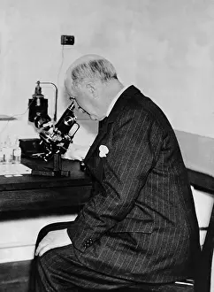 Laboratories: William Henry Bragg at the microscope, 1936