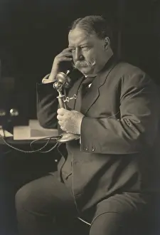 Rectangles: William Howard Taft, smiles as he learns by telephone