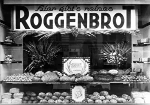 Advertises: Window display of a bakery