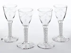 Glassware: Four wine glasses