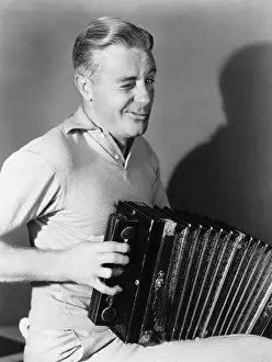 Wink: Winking man playing accordion