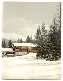 Grisons: Winter scene with log structure, Grisons, Switzerland