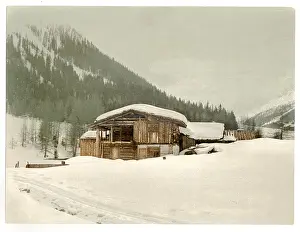 Grisons: Winter scene with log structure, Grisons, Switzerland