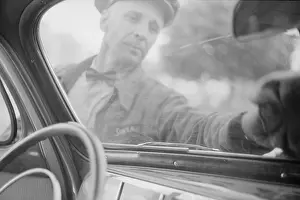 Windshield: Wiping off windshield in service station, Cairo, Illinois