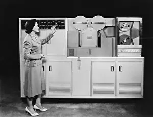 Tapes: Woman with a 1950s computer
